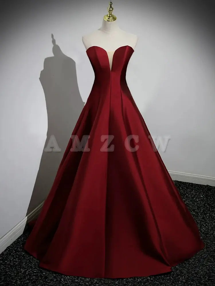 Vestido de fiesta largo burdeos de satén con mangas abullonadas y corte A de Amzcw. Vestido formal largo burdeos. Tiendas de vestidos de fiesta.