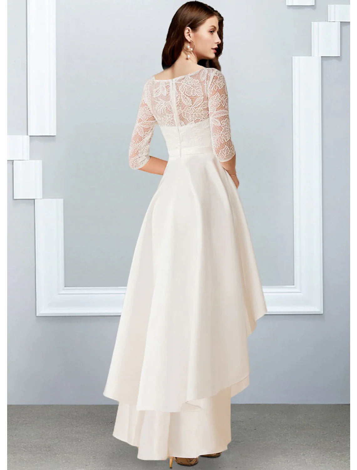 Full length view of the A-line reception dress, showcasing the flowing chiffon fabric and ruffled skirt.