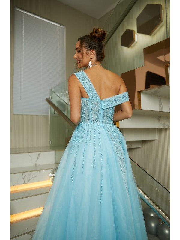 Detail of the delicate beading on the organza fabric of the formal dress.