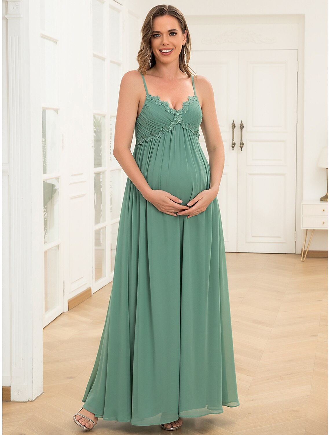 Full length view of the floor-length A-line maternity evening gown.
