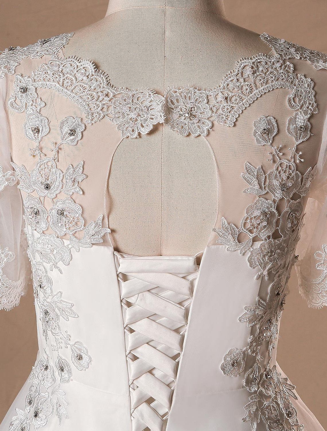 Fabric and crystal detail on the luxurious satin bridal gown.
