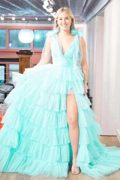 Vestido de fiesta con escote en V, abertura hasta el suelo y volantes 