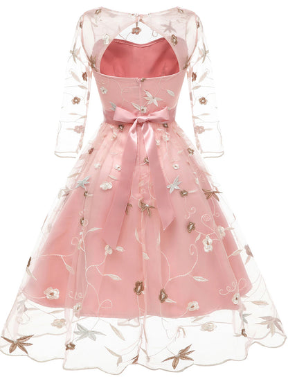 Back view of an A-line floral tulle cocktail dress with embroidery appliques.