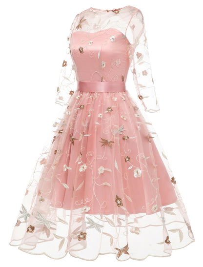 Side view of an A-line knee-length dress with floral embroidery.