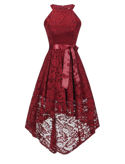 Model posing in an A-line halter lace dress, showing the full silhouette.