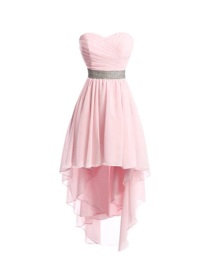 Full length view of a model posing in an asymmetrical strapless homecoming dress.