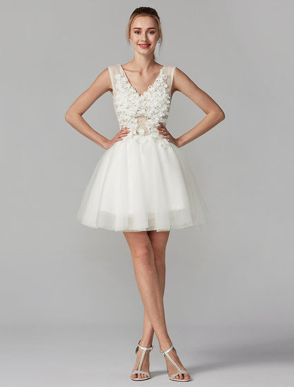 Model posing in a short A-line dress, showcasing the full design and flow of the tulle skirt.