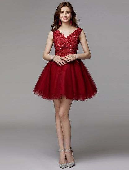 Model looking over her shoulder, displaying the back details of the short party dress.