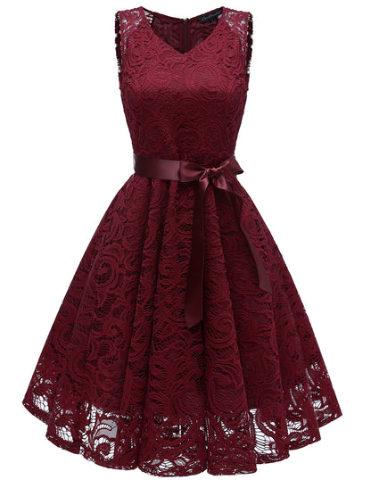 Close-up of lace and bow detail on an A-line dress.