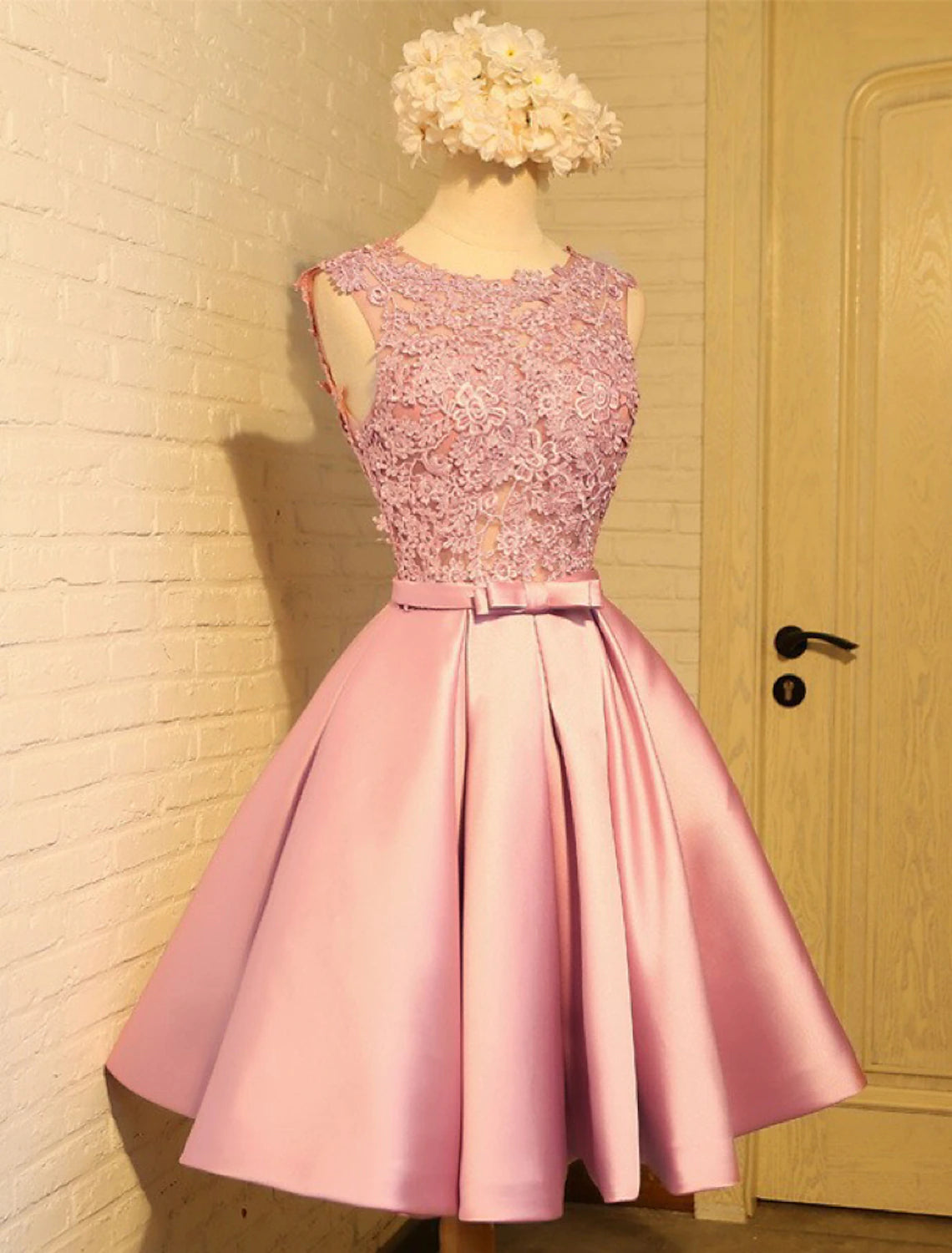 Side view of the knee-length satin dress, highlighting the A-line silhouette.