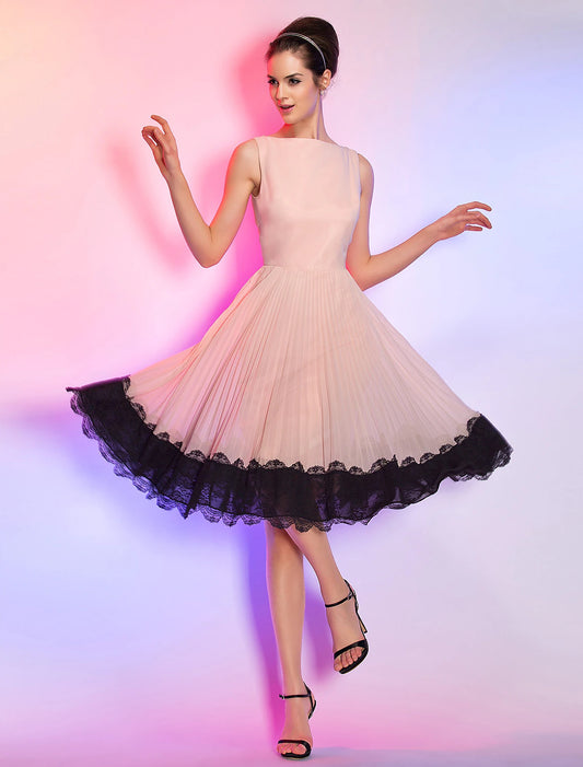 Model wearing a pink A-line homecoming dress with lace details and a boat neck.