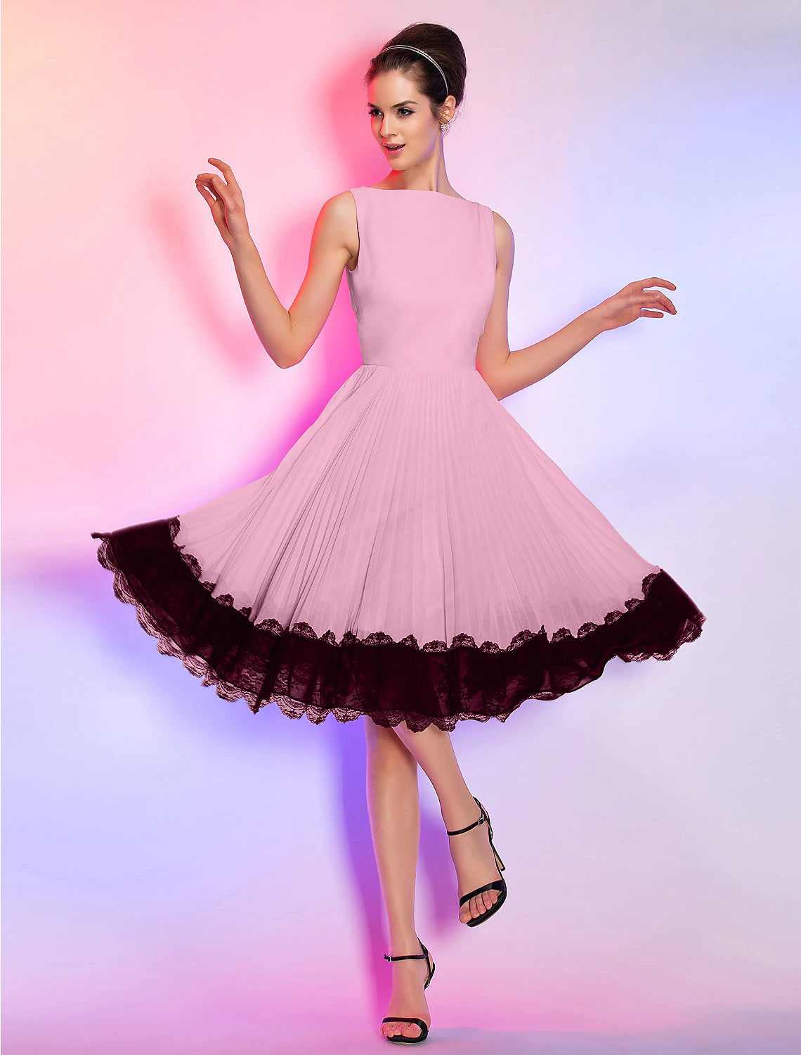 Full view of the pink A-line dress, highlighting its flowy chiffon skirt.