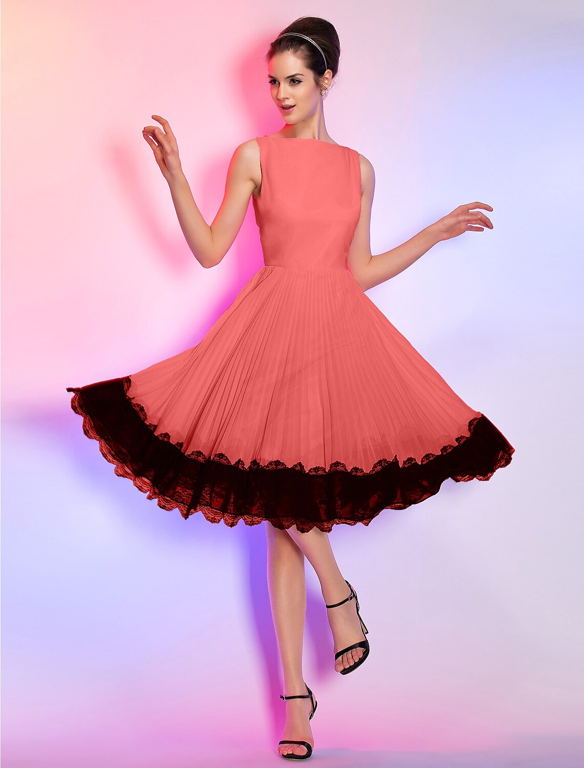 Elegant pink A-line dress for homecoming, showcasing its knee-length cut.
