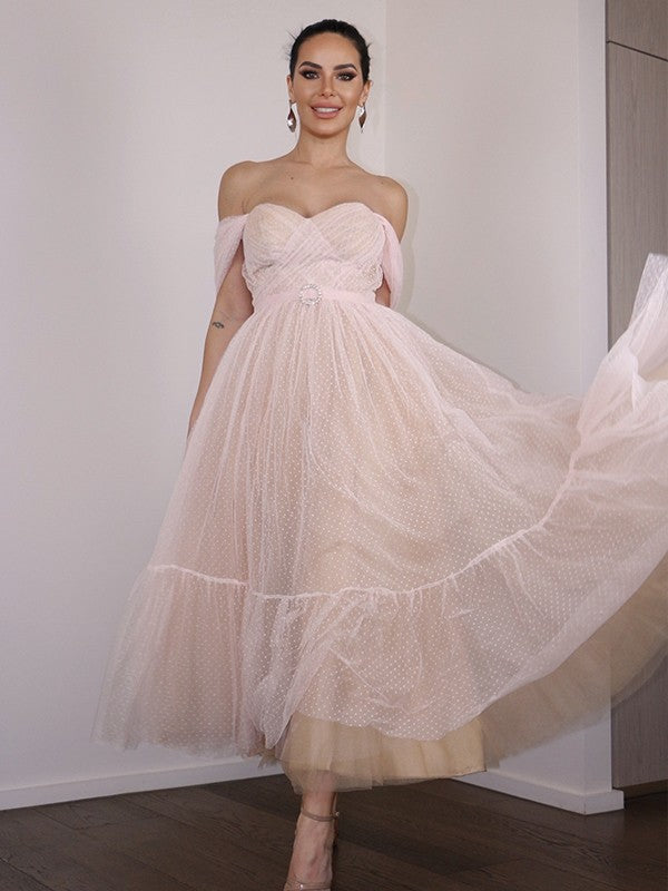 Front view of an A-Line lace off-shoulder tea-length homecoming dress with ruched details.
