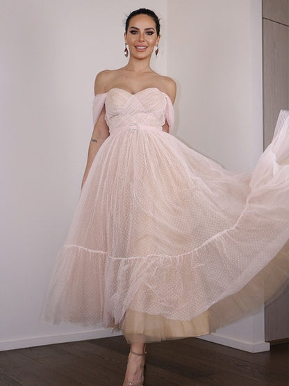 Front view of an A-Line lace off-shoulder tea-length homecoming dress with ruched details.