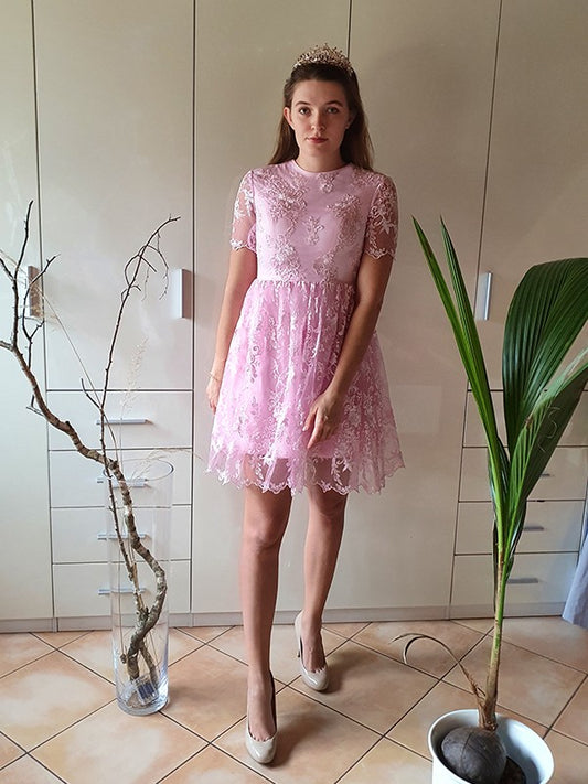 A-Line Princess short homecoming dress with sheer organza neckline and applique details.
