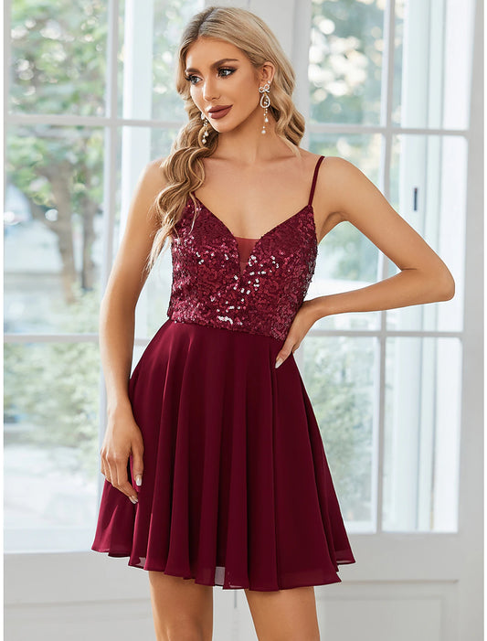 A-line short homecoming dress with sequins and pleats.