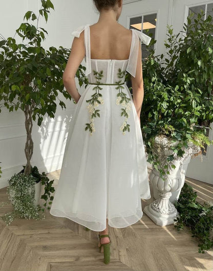 Vestido de fiesta con tirantes en la espalda, corte A, apliques y bolsillos 