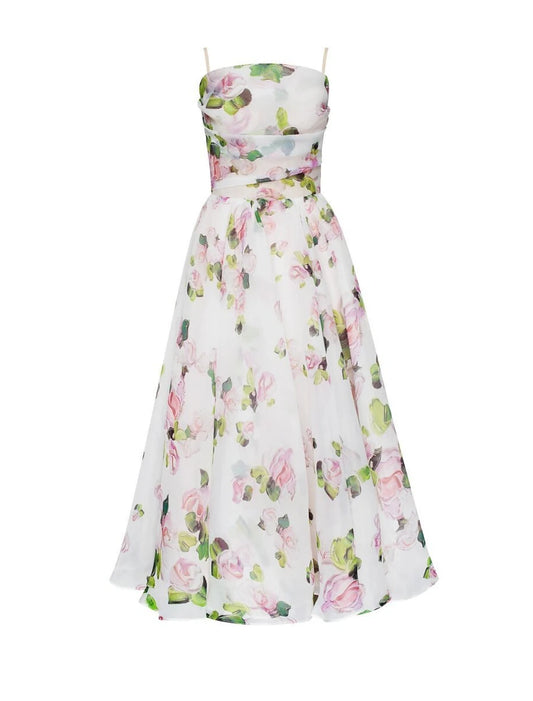 Model wearing an A-line tea length homecoming dress with a unique print.