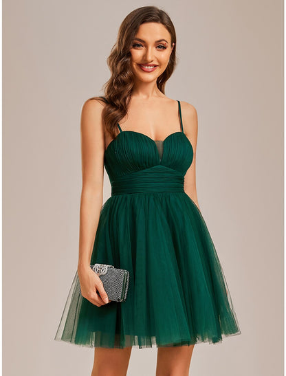 Full view of a light blue A-line short homecoming dress with a flowing tulle skirt.