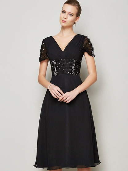 Front view of an A-Line V-neck chiffon homecoming dress with short sleeves and ruffles.