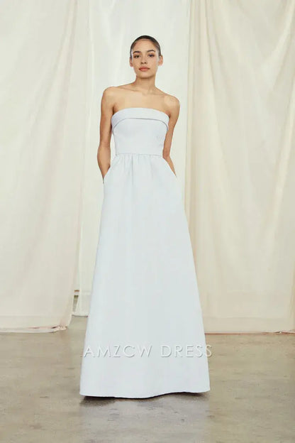 Elegante vestido largo azul claro sin tirantes y con bolsillos de Amzcw - Vestidos de novia y formales atemporales 