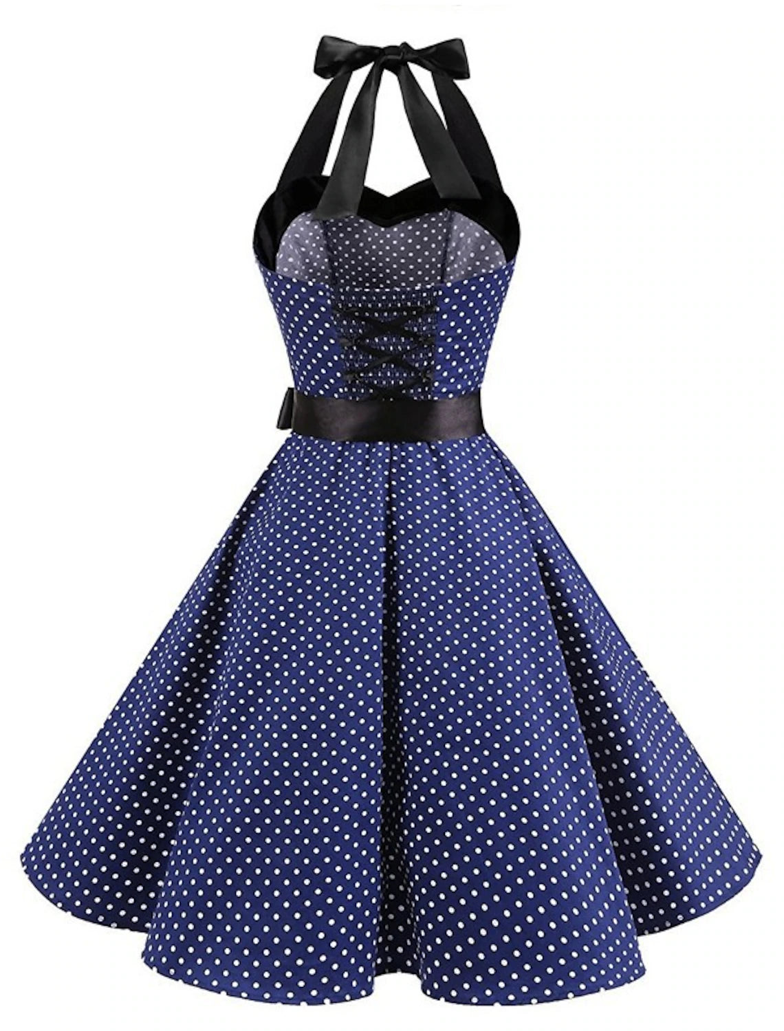 Woman wearing a black polka dot halter neck flare dress, side view.