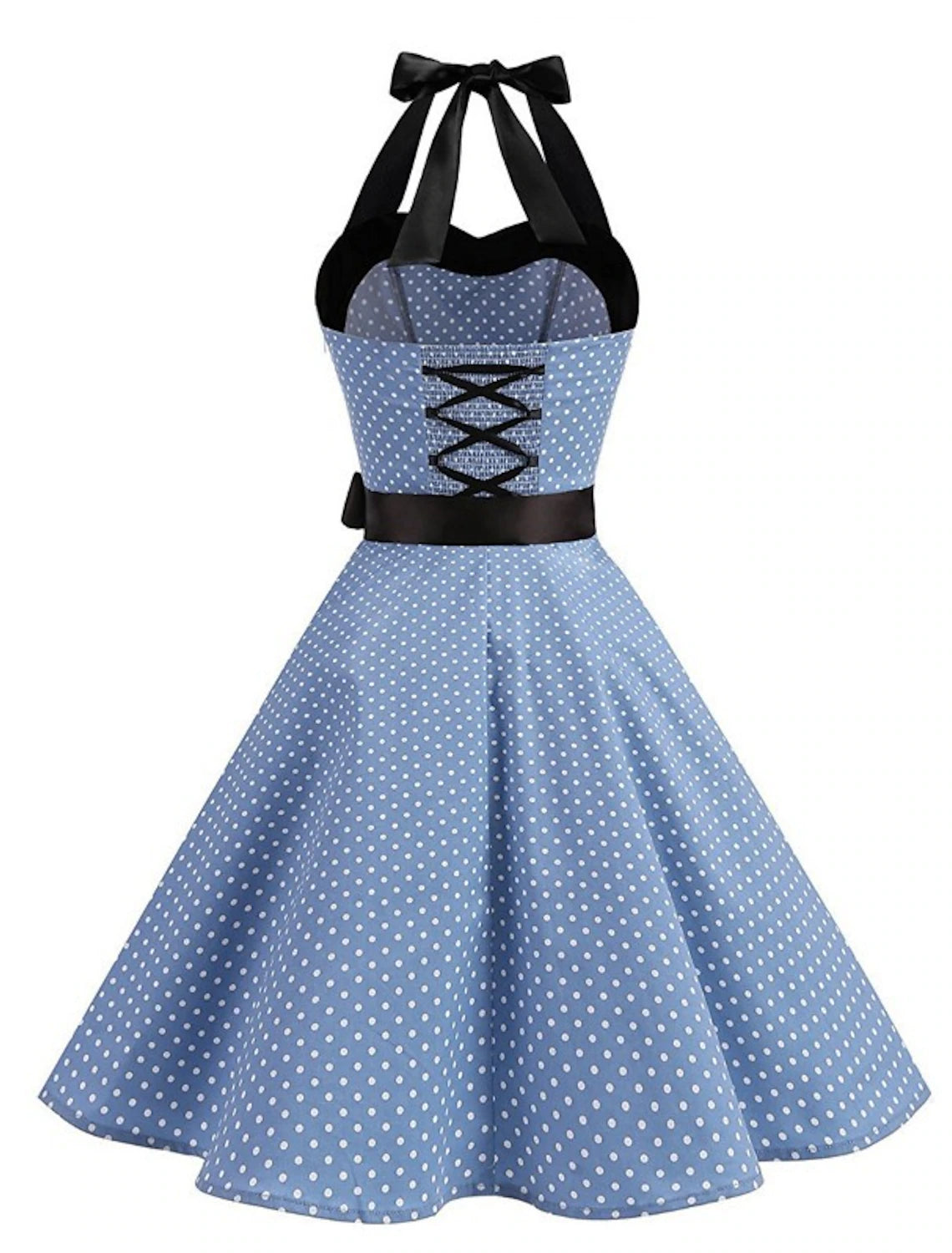 Woman posing in a black polka dot halter neck flare dress.