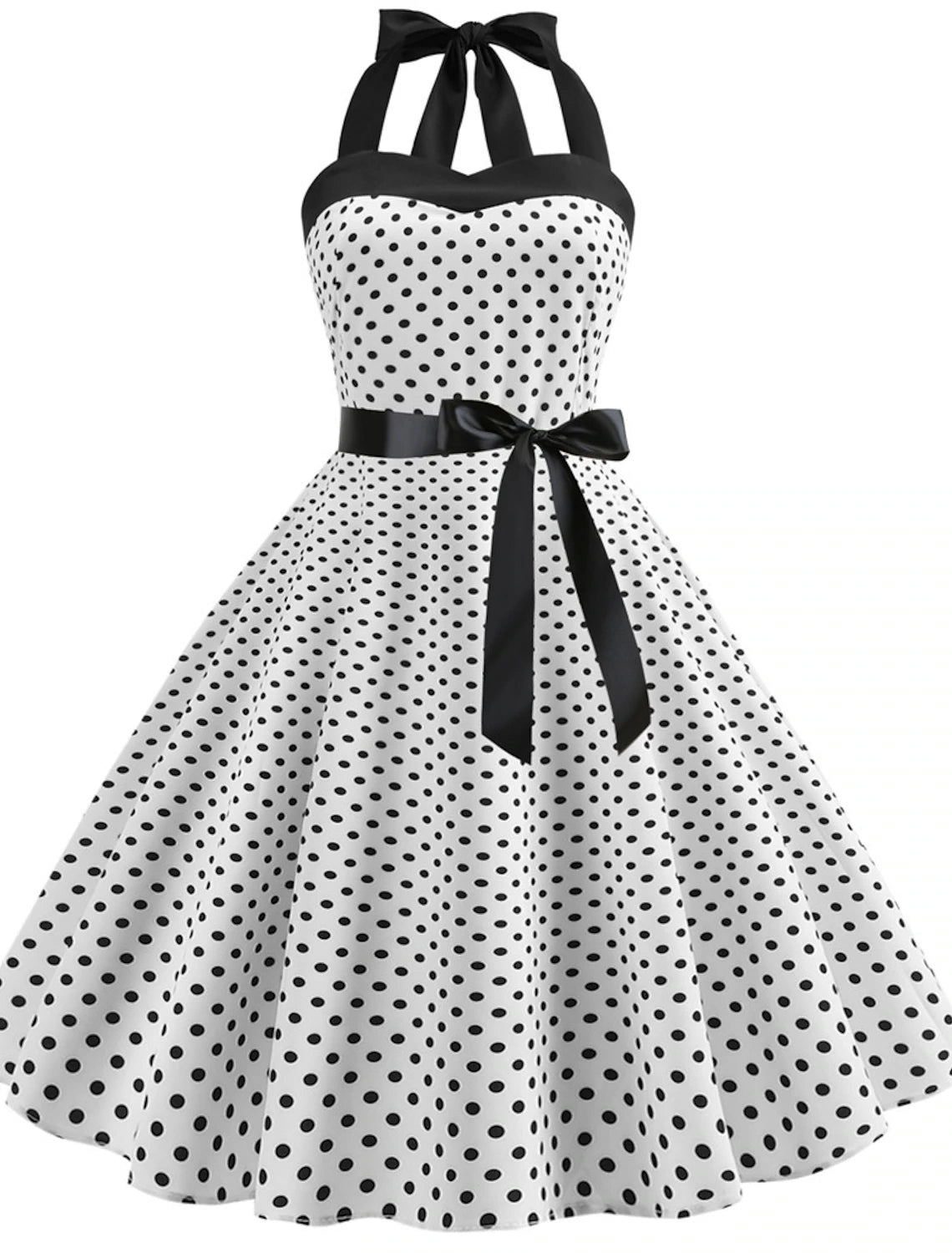 Woman posing in a red polka dot halter neck flare dress.