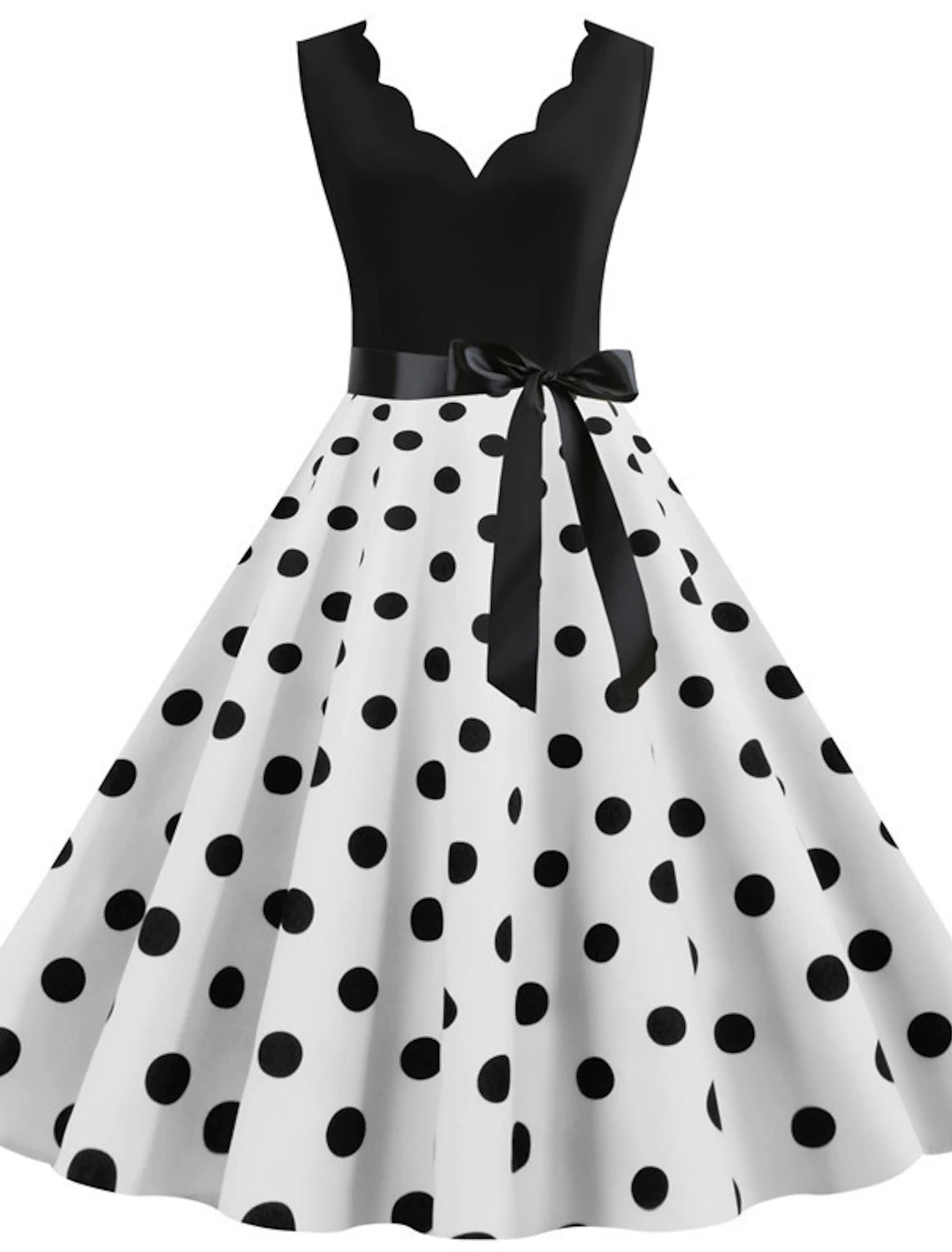 Woman wearing an elegant 1950s polka dot flare dress with a sweetheart neckline.