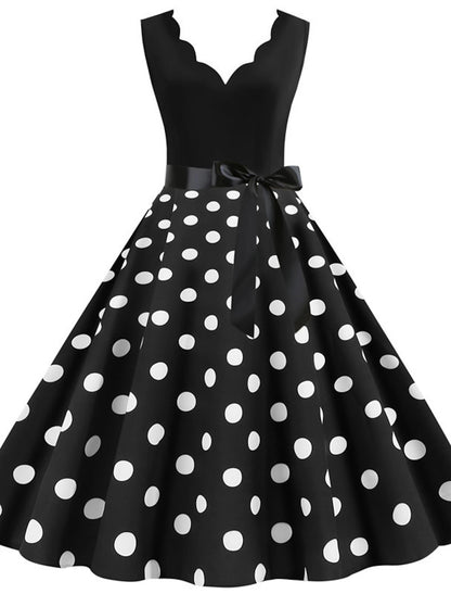 Side view of a woman in a classic polka dot rockabilly style dress.