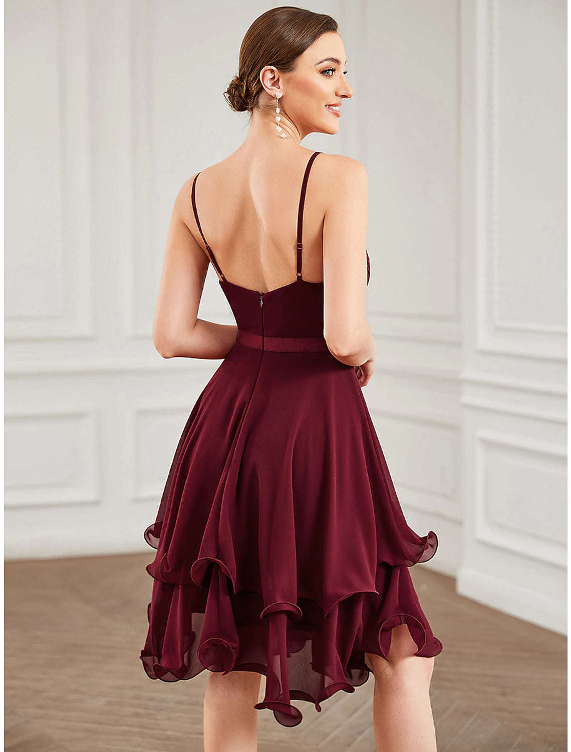 Back view of a pure color tiered chiffon homecoming dress.