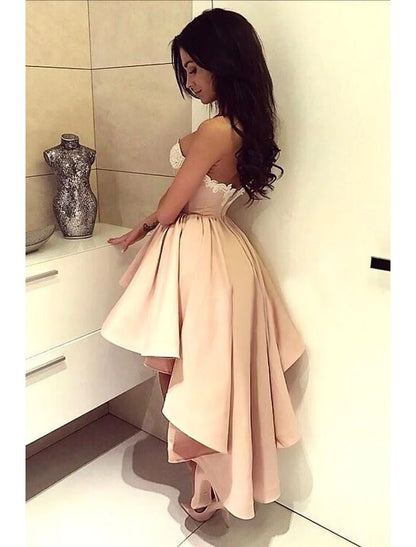 Side view of an A-line satin cocktail dress, highlighting the asymmetrical hem and flowing skirt.