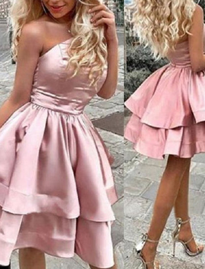 Back view of a model in a one-shoulder A-line satin mini dress, highlighting the elegant drape.