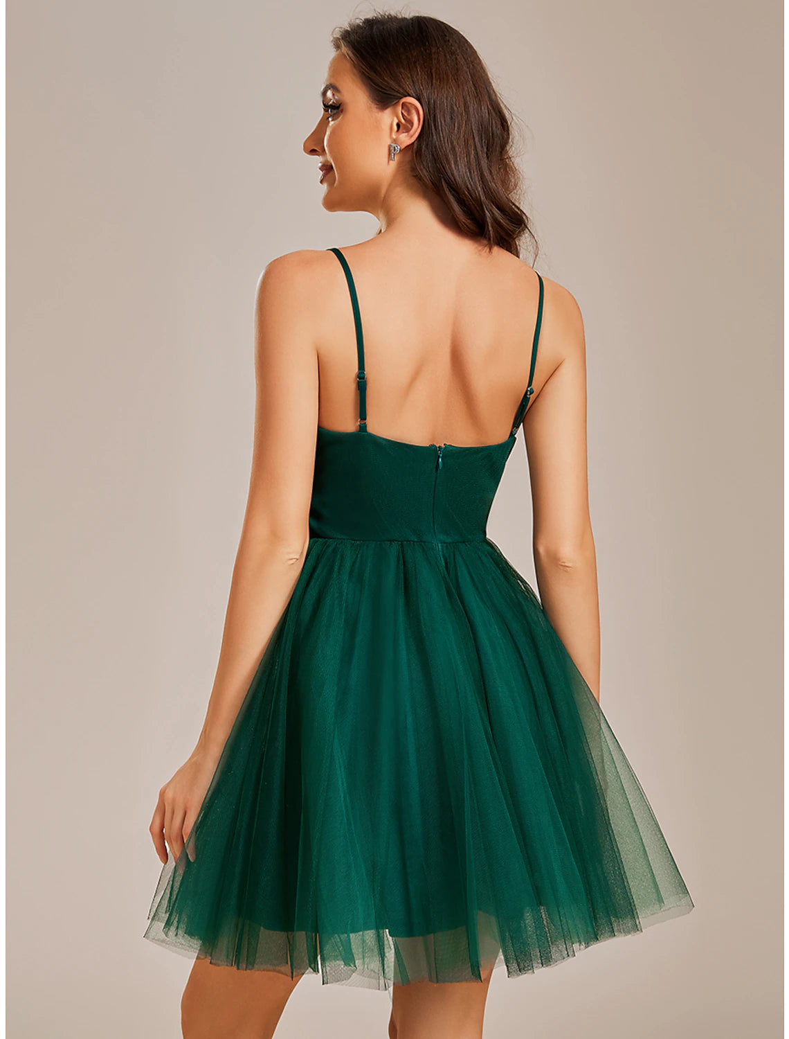 Model posing in the A-line short tulle dress, ready for a party.