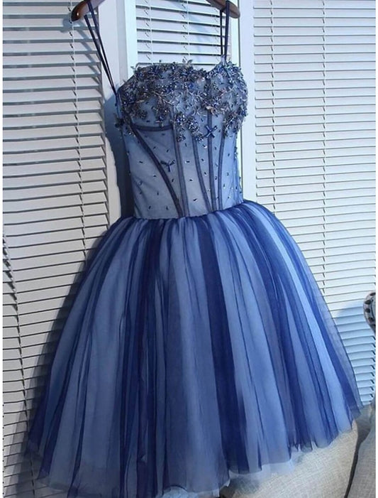 Front view of an elegant A-Line tulle homecoming dress with spaghetti straps and rhinestones.