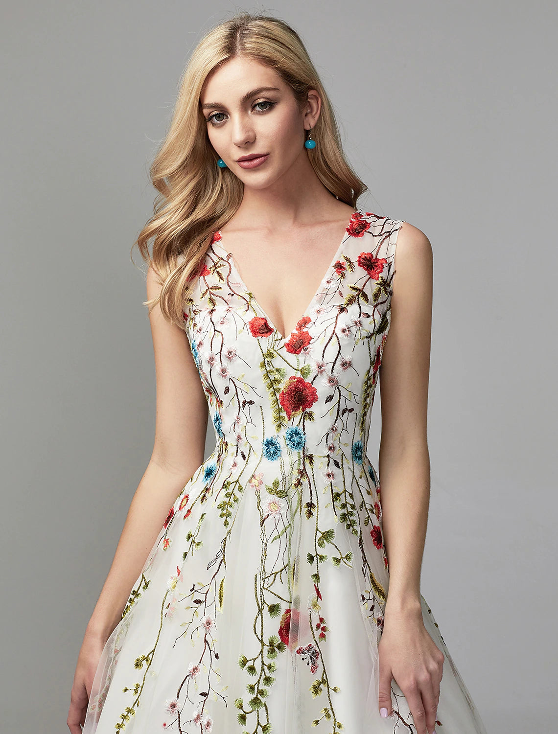 Side view of an elegant A-line V-neck lace floral gown.
