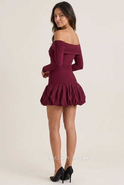 Back view of a woman in a burgundy off-shoulder long sleeve mini dress with a ruched bubble skirt.