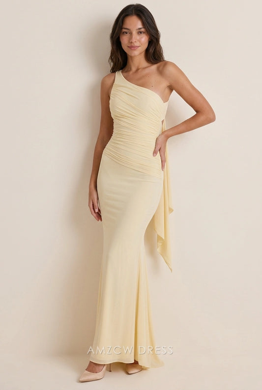 Elegant pale yellow one-shoulder mermaid prom dress with ruched bodice, front view.
