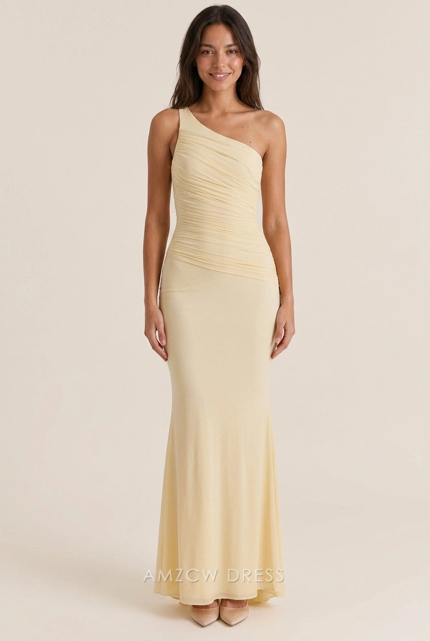 Pale yellow one-shoulder mermaid prom dress with open back design, rear view.