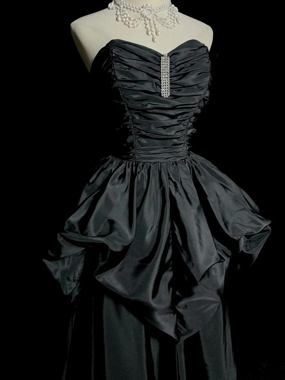 Evening Dress Strapless Black Satin Gown with Ruched Bodice, Crystal Accent and Dramatic Peplum Skirt