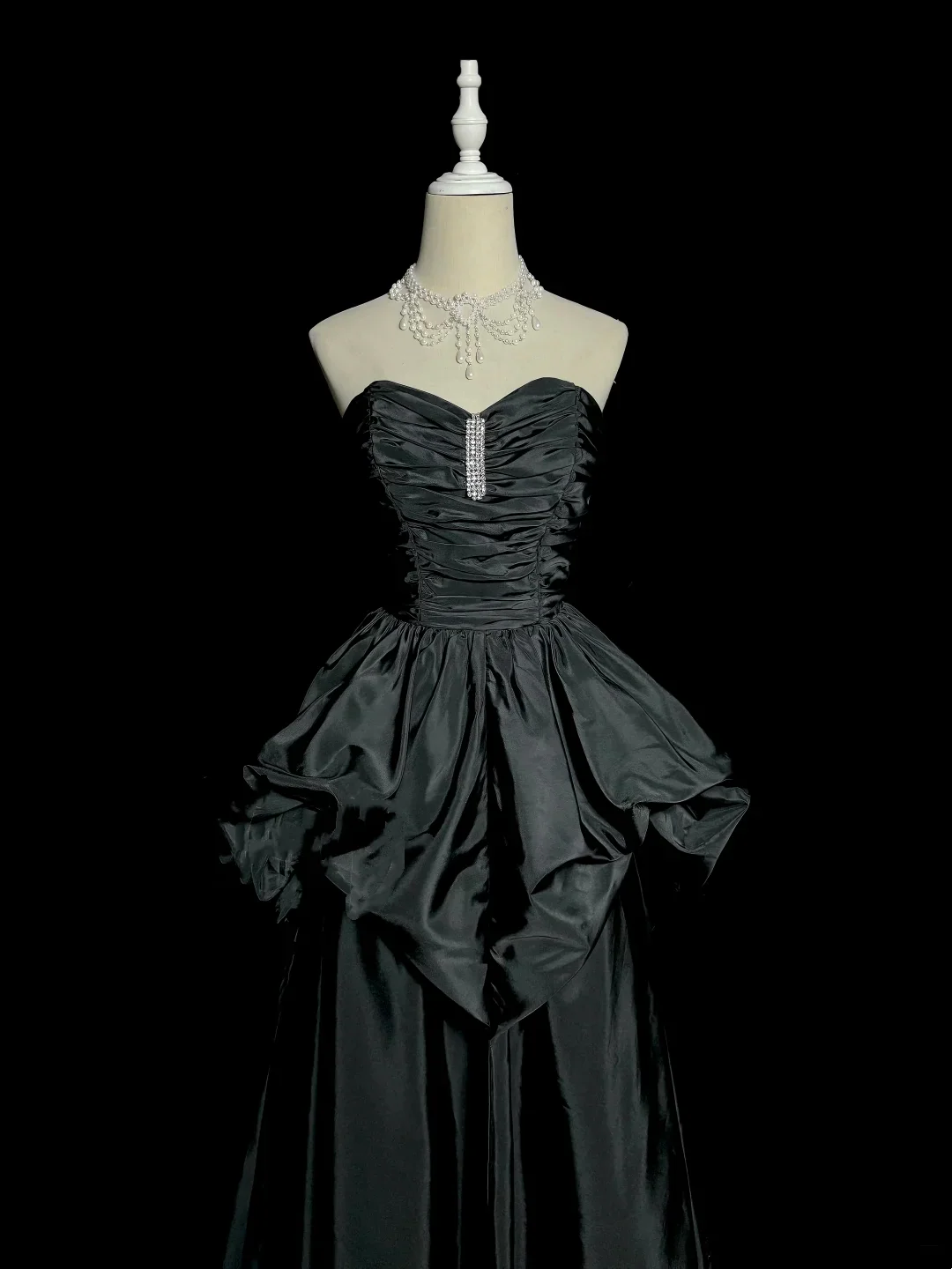Evening Dress Strapless Black Satin Gown with Ruched Bodice, Crystal Accent and Dramatic Peplum Skirt
