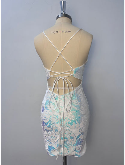 Back view of a glitter tulle floral sheath dress with spaghetti straps.