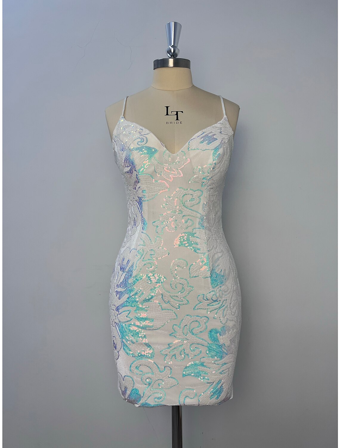 Close-up of the glitter tulle fabric and floral pattern on the dress.