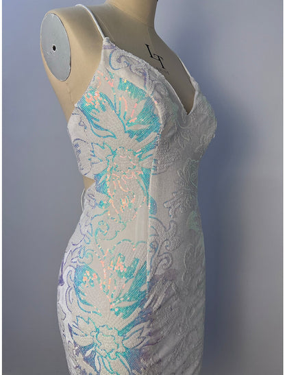 Side view of a model in a short glitter tulle floral dress.