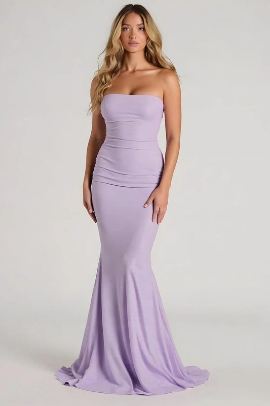 Lavender strapless mermaid prom dress with ruched bodice form-fitting silhouette and floor-length train