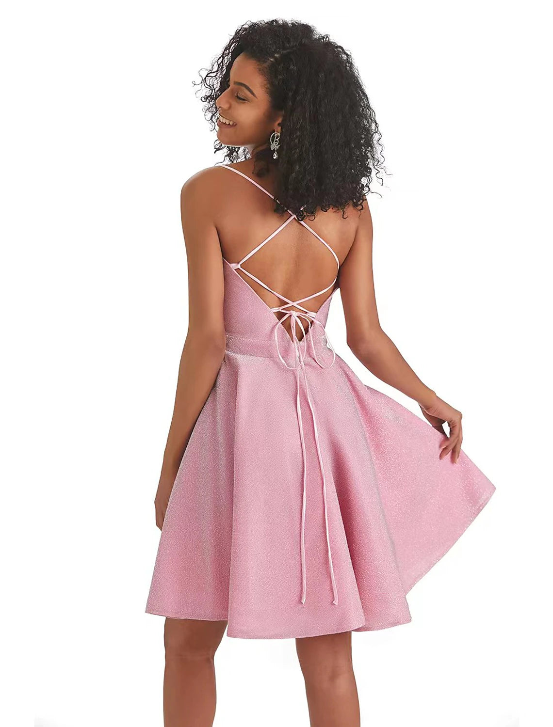 Side view of a pink backless mini dress, showcasing the A-line silhouette and sequin embellishments.