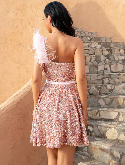 Side profile of the pink sequin feather one-shoulder short dress.