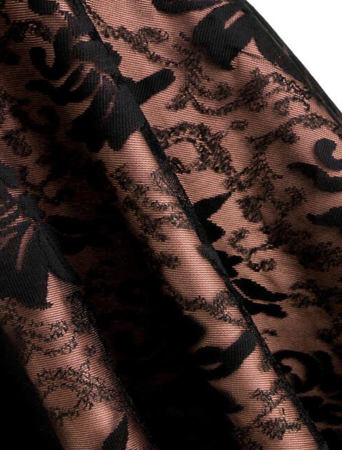Detailed view of the lace trim and layered fabric on the skirt of the Gothic Lolita dress.