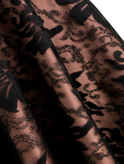 Detailed view of the lace trim and layered fabric on the skirt of the Gothic Lolita dress.